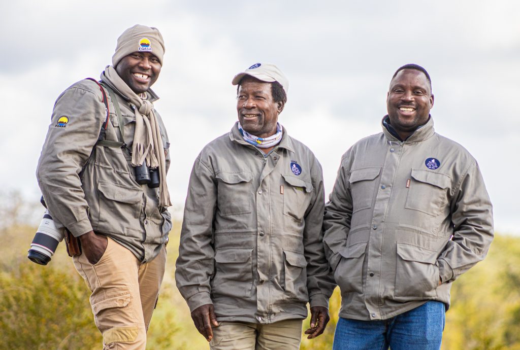 Godfrey stands with Lucas Mathonsi and Togara Charingira